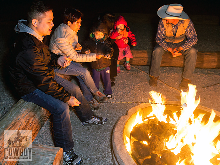 Sitting around the campfire eating Cowboy Smores after Horseback Riding in Las Vegas at Cowboy Trail Rides in Red Rock Canyon