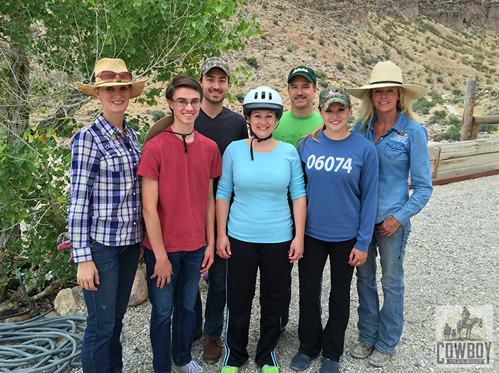 A picture of wranglers Chelsea and Sandi with the Logan family before Horseback Riding in Las Vegas at Cowboy Trail Rides in Red Rock Canyon